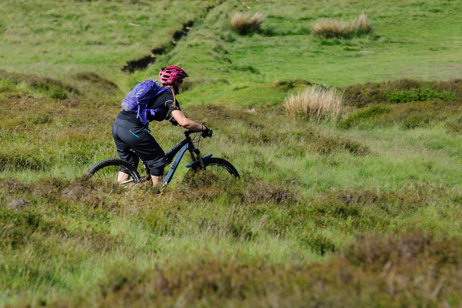 woman riding mountain bike trails in north wales