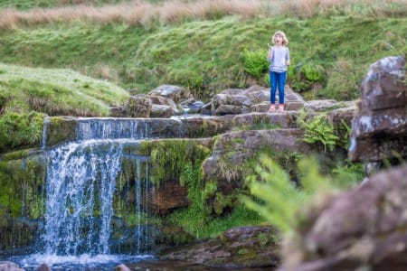 Girl next to Brecon Beacons Waterfall