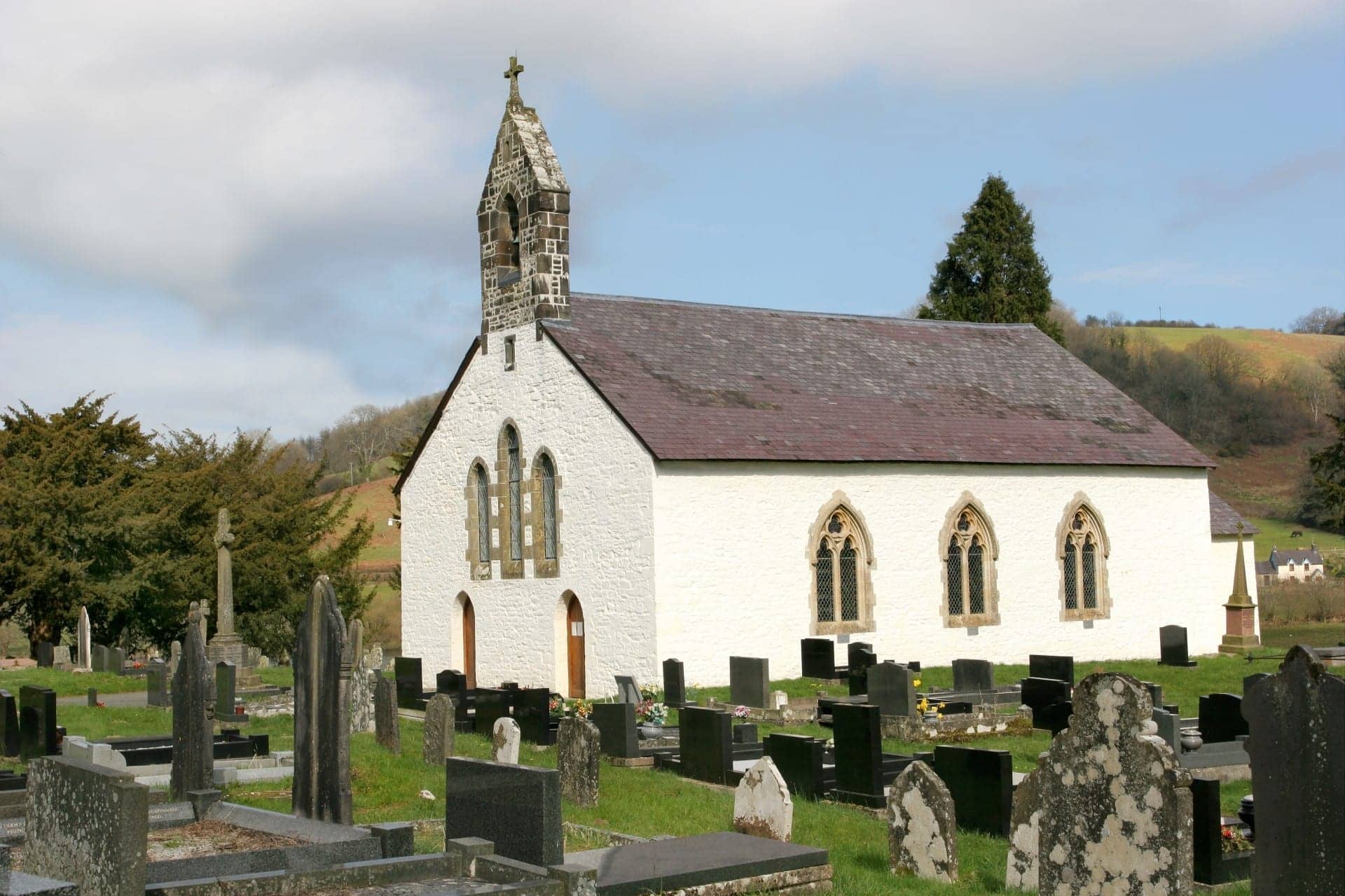 A chapel with the graveyard in the picture in wales