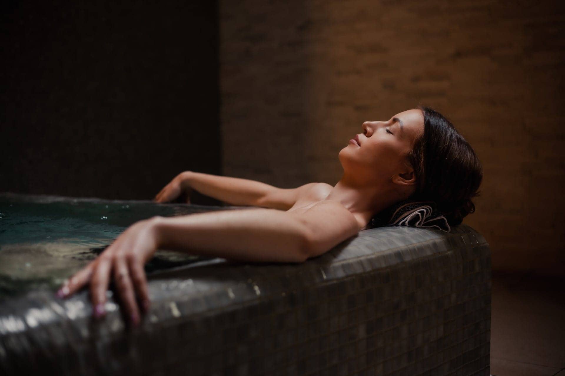 lady relaxing in a hot tub