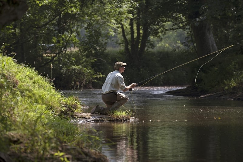 Angler fly fishing in Wales
