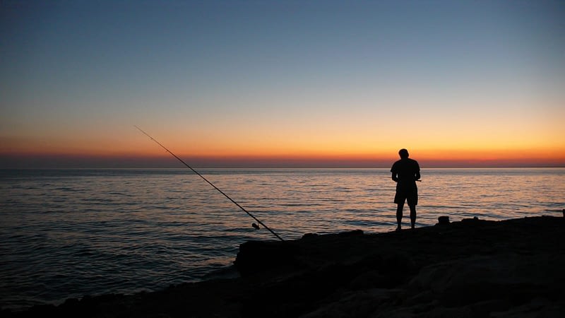 sunset sea angler