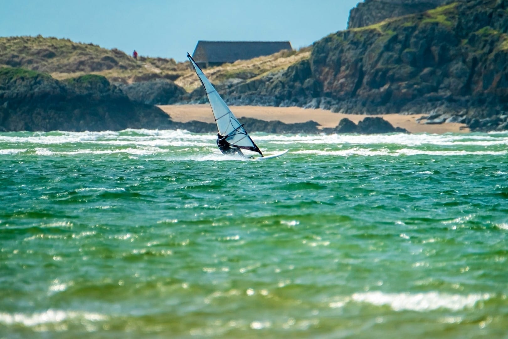 Man Wind Surfing on Welsh beach